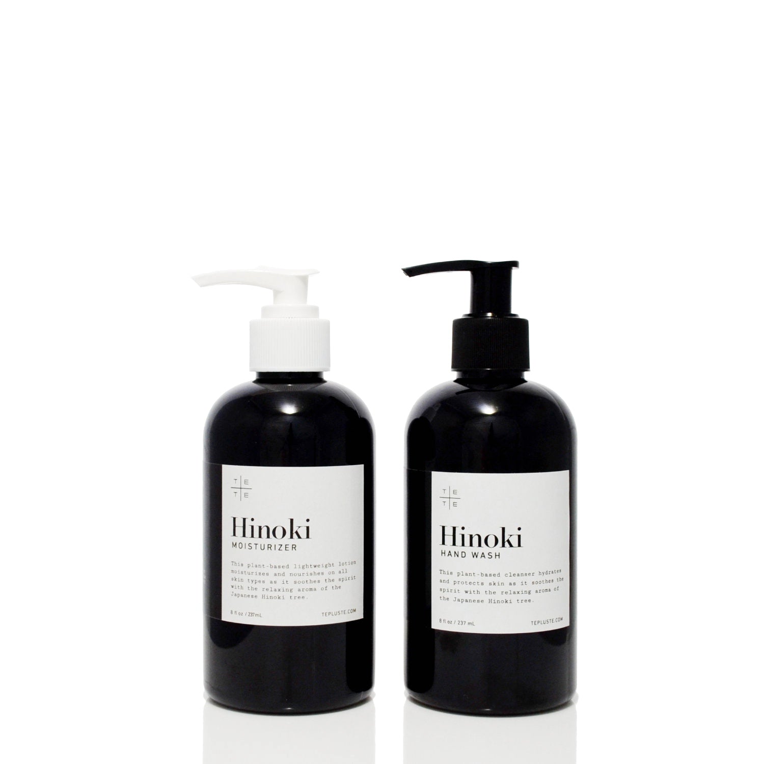 Two black bottles with pump dispensers labeled 'Hinoki' on a white background