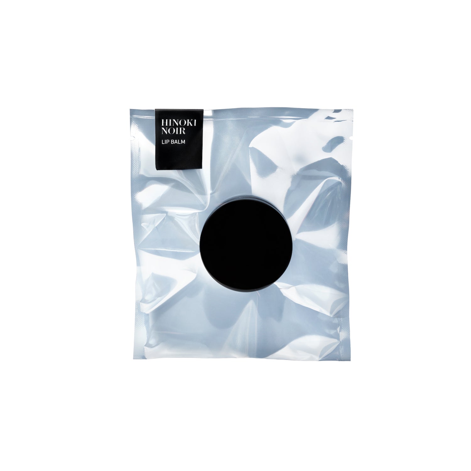 Hinoki Noir Lip Balm in package
